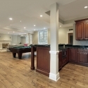 Basement with fireplace and bar