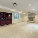 Basement with fireplace and bar