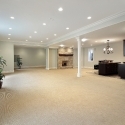 Basement with stone fireplace